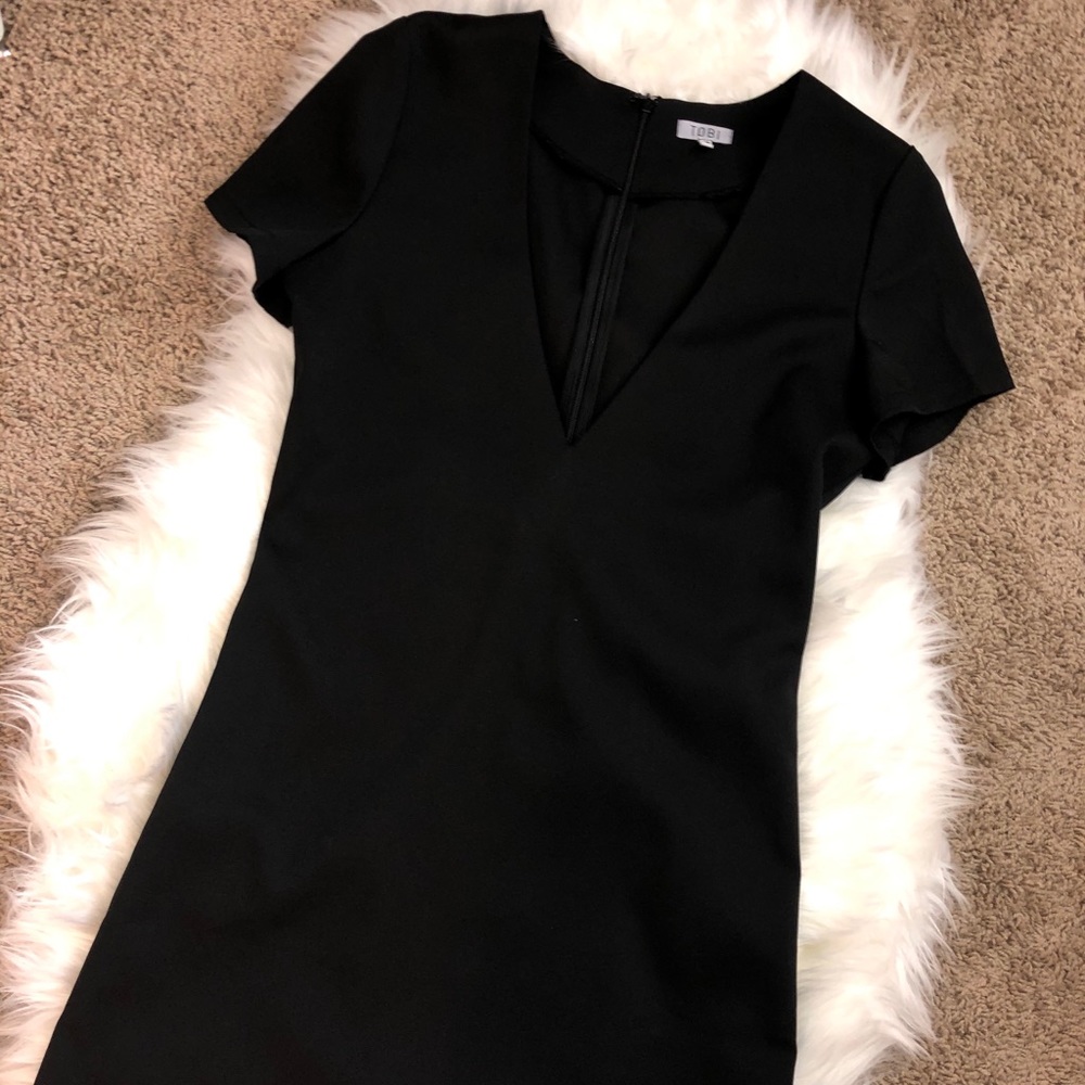 TOBI black low cut dress. Never worn.